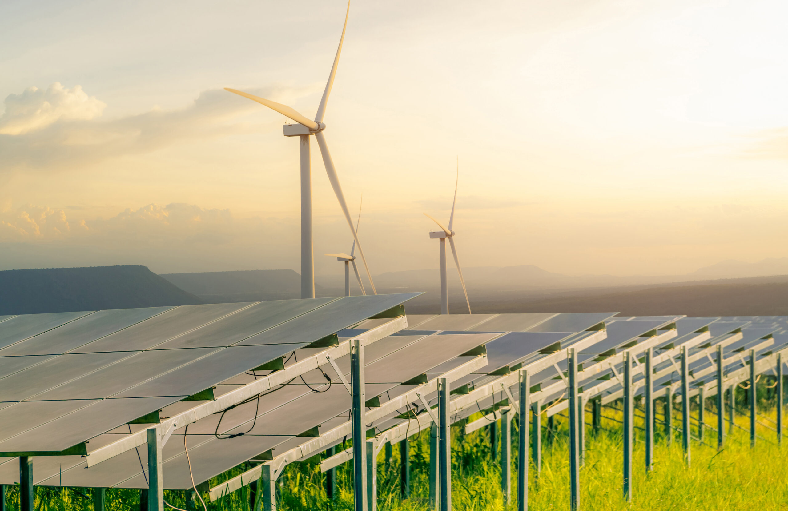 Sustainable energy. Solar and wind turbines farm.